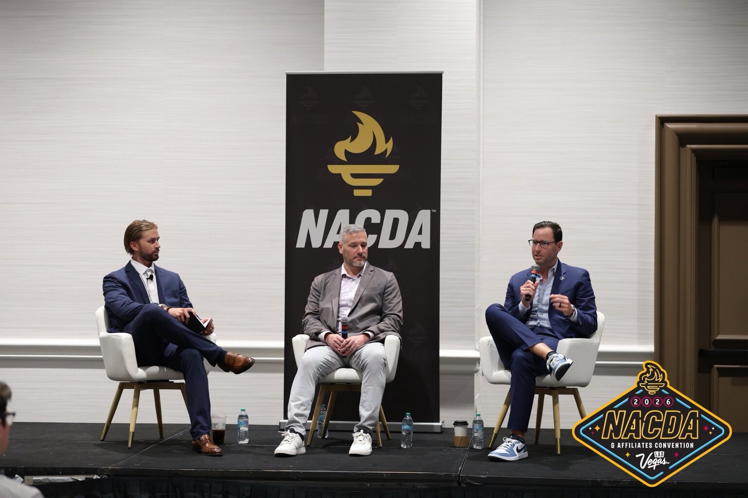 Tate Gillespie moderating a sports-industry panel